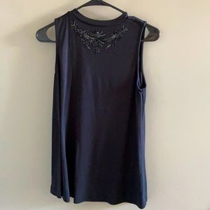 Sleeveless blouse with stunning beaded collar